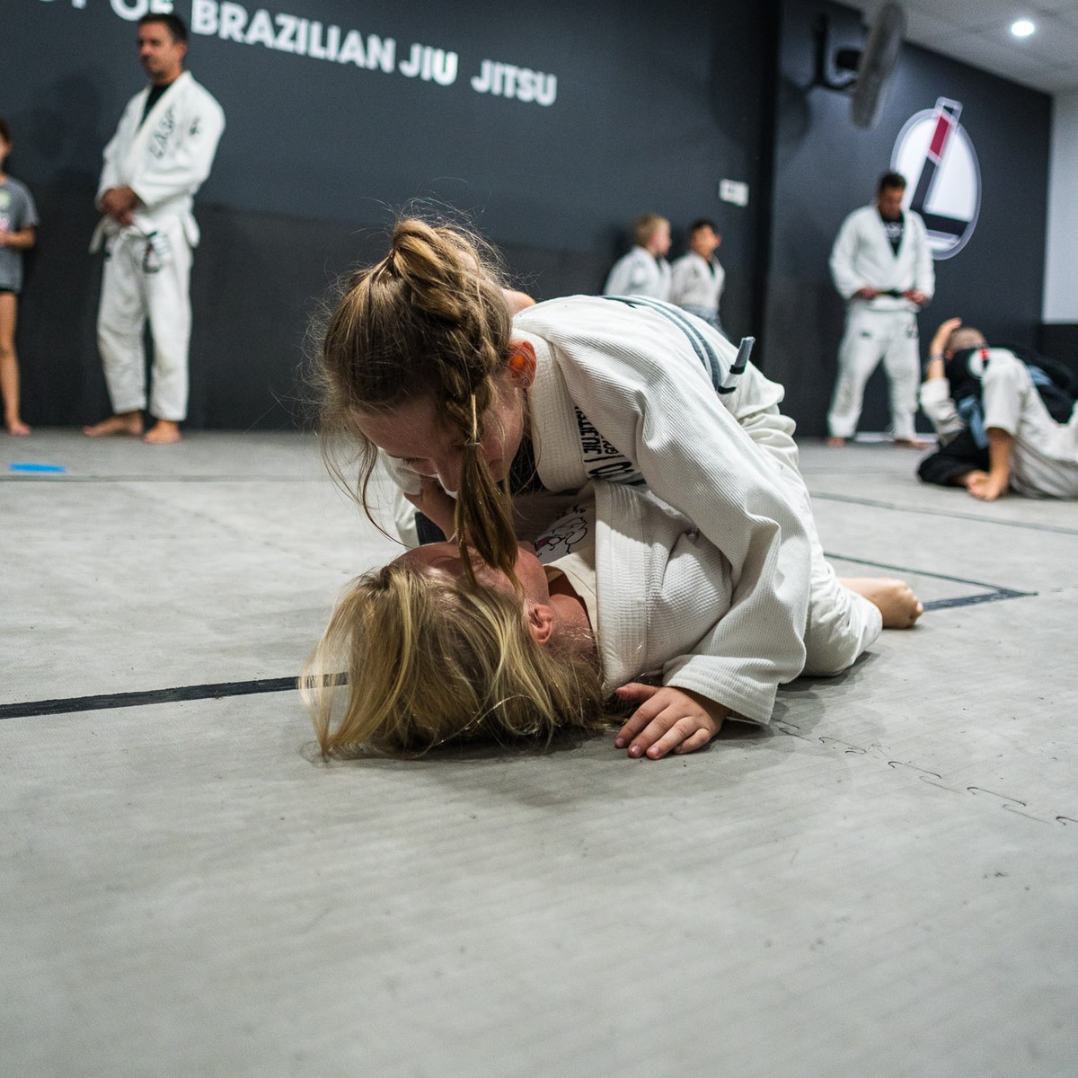 Two girls practising Brazilian Jiu Jitsu at Lasco on the Gold Coast