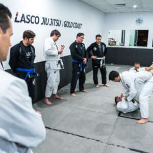 Adult students watching a Brazilian Jiu Jitsu demonstration at Lasco on the Gold Coast