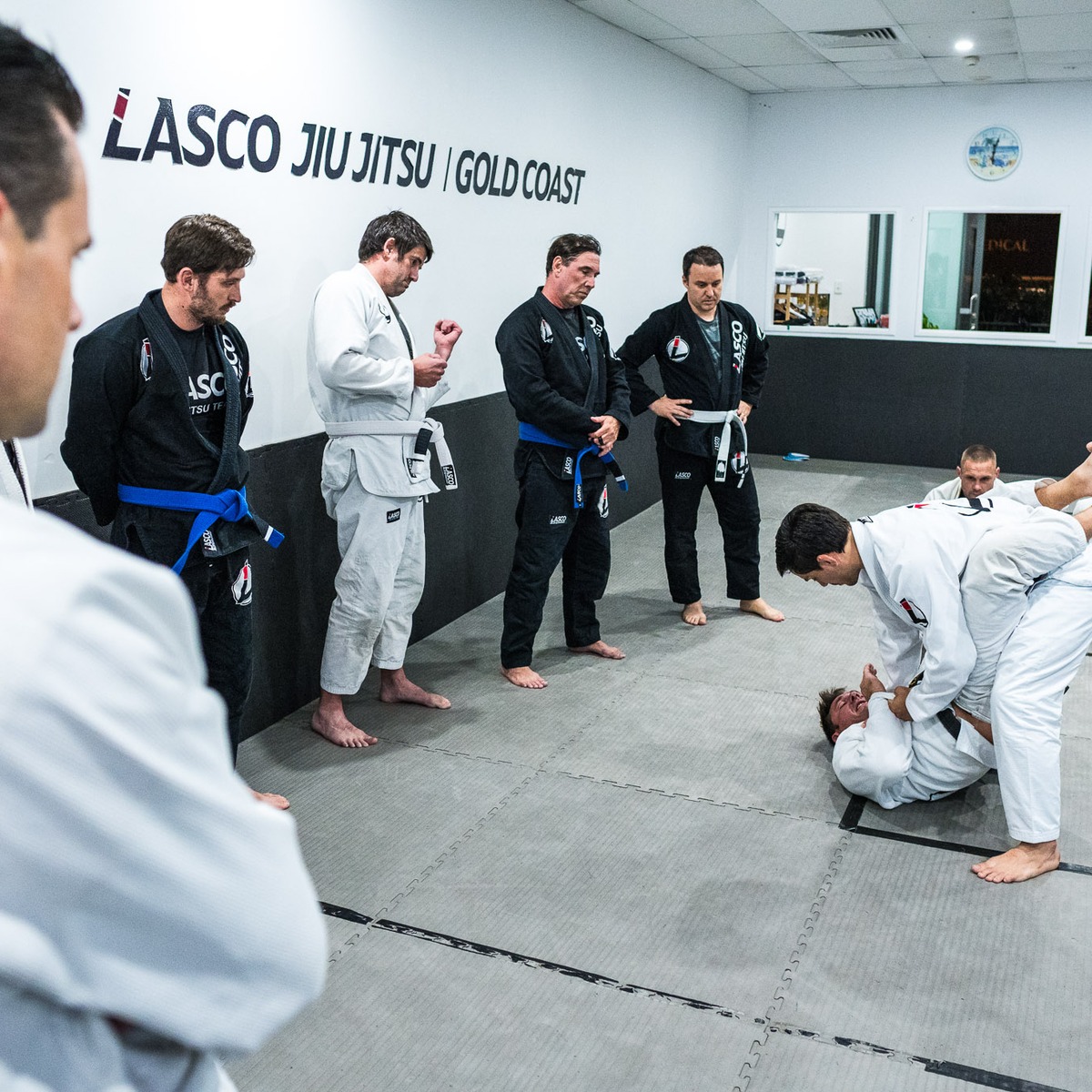 Adult students watching a Brazilian Jiu Jitsu demonstration at Lasco on the Gold Coast